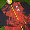 Picture of Real Madrid 2024 Double Sided Jacket Black & Red/Yellow